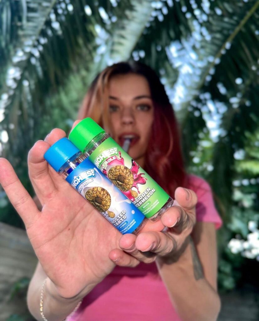 photo of a lady holding jelly hole prerolls delta munchies